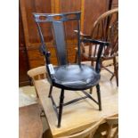 A James Shoolbred ebonised salon chair