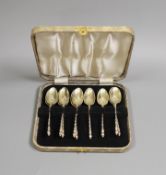 A set of nine Victorian chased silver tea spoons, by George Adams, London, 1874, 135 grams.