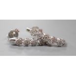 A modern pair of 375 white metal and diamond quintuple cluster set demi-lune earrings, 16mm, gross