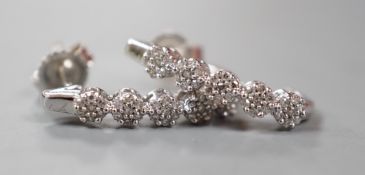 A modern pair of 375 white metal and diamond quintuple cluster set demi-lune earrings, 16mm, gross