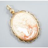 A gilt metal mounted oval ceramic? cameo pendant, 35mm.