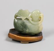 A Chinese carved jade figure of a duck, with stand. 5cm long