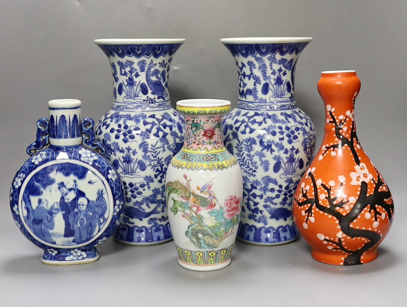 A pair of Chinese blue and white vases, two other vases and a moon flask, tallest 28cm
