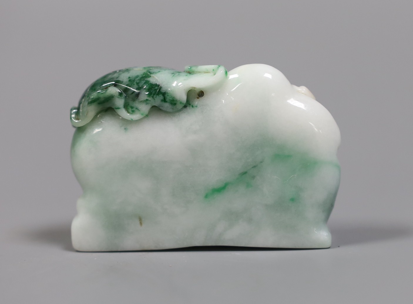 A Chinese jadeite Budai reclining figure, 6 cms wide, - Image 2 of 4