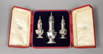 A cased Edwardian three piece pepperette and sugar caster set, by Jay, Richard Attenborough & Co,