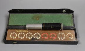 An Otis King's pocket calculator and a cased Addometer,