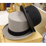 An Austin Reed boxed grey top hat together with a black bowler hat,