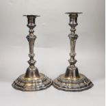 A pair of French Louis XVI cast white metal candlesticks and sconces, with waisted knopped stems, on
