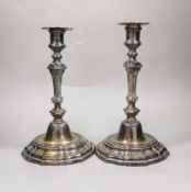 A pair of French Louis XVI cast white metal candlesticks and sconces, with waisted knopped stems, on