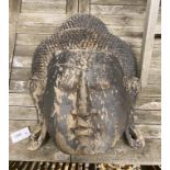 An Asian carved and painted hardwood Buddha mask, height 50cm