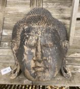 An Asian carved and painted hardwood Buddha mask, height 50cm