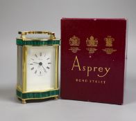 An Asprey carriage timepiece with key, 12 cms high, and an Asprey presentation box,