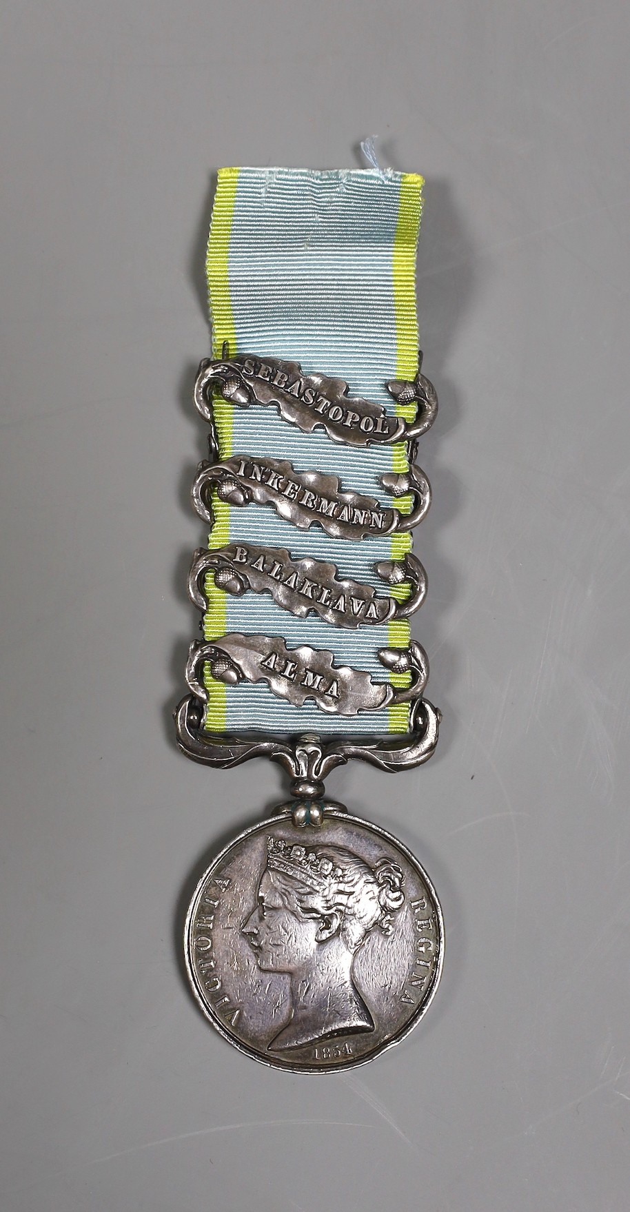 A Crimea war medal with 4 clasps - ‘Sebastopol’, ‘Inkermann’, ‘Balaklava’ and ‘Alma’ stamped 3722