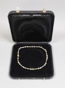 A cased modern 750 yellow metal and Tahitian? pearl set necklace, with diamond chip set clasp, 39cm,