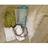 Two 1920's floral bead headdresses, a baby dress, gold fabric, two feathers and three prs of