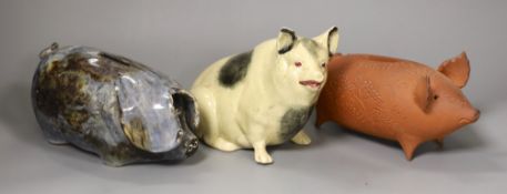 An early 20th century glazed pottery pig and 2 studio pottery pigs by Paul Whalley and Quinnett