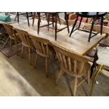A modern bleached wood kitchen table, length 210cm, height 85cm with a set of eight beech kitchen
