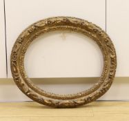 An 18th century hand carved gilt gesso oval frame,52 cms high