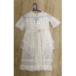 A young girl's 1920's-30's cream net and lace trimmed confirmation dress,