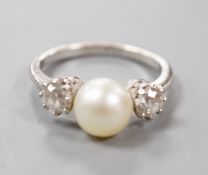 A white metal (stamped plat), single stone diamond and two stone cultured pearl set dress ring, size