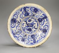 An 18th century Spanish blue and white maiolica dish, possibly Talavera, 31cm