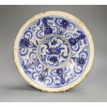 An 18th century Spanish blue and white maiolica dish, possibly Talavera, 31cm