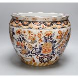 A late 20th century Chinese Imari fish bowl, 31 cms high,