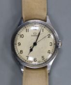 A gentleman's early 1940's stainless steel Omega manual wind wrist watch, on associated fabric