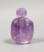 A carved amethyst quartz scent bottle and stopper, 9.5 cms high,