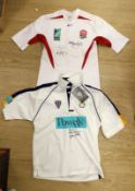 An England Rugby World Cup 2003 shirt signed by Martin Johnson, and two other players and a