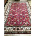 A Tabriz style red ground carpet, 315 x 198cm