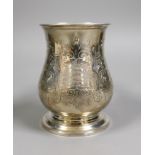 A Victorian foliate engraved silver baluster pint mug, Richards & Brown, London, 1860, height 12.