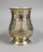 A Victorian foliate engraved silver baluster pint mug, Richards & Brown, London, 1860, height 12.