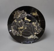 Bjorn Winblad for Rosenthal a gilt decorated black ground charger, 32.5cm diameter