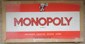 A box of miscellaneous Victorian games and an early Monopoly
