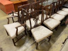 A set of ten Chippendale style mahogany dining chairs including two carvers, width 64cm, height