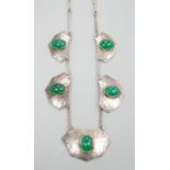 An Arts of Crafts planished white metal and five stone chrysoprase set necklace, 54cm.
