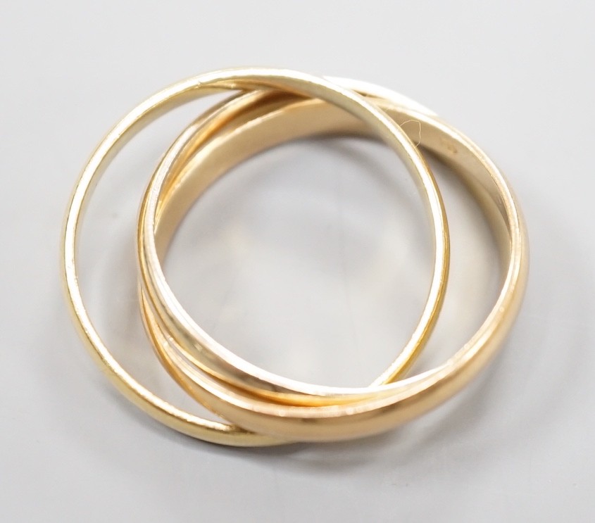 A modern Cartier three colour 750 yellow metal 'Russian' triple wedding ring, size U, 8.5 grams. - Image 4 of 5