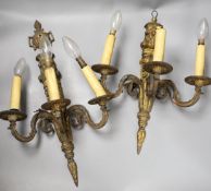 A pair of Baroque style ormolu three branch wall lights