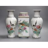 A pair of early Chinese famille rose vases and another similar, Republic period, tallest 26cm