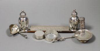 A quantity of small silver or white metal items including a long handled server spoon, Chinese