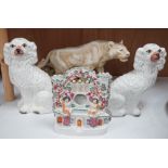 A Royal Dux tiger, a pair of Staffordshire Spaniels and a figural flat back,tiger 48 cms high,