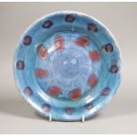 Quentin Bell, Fulham pottery blue glazed wall plate,23 cms diameter,