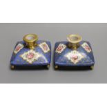 A pair of mid 19th century Paris porcelain 'cushion' shaped scent bottles decorated in Sevres