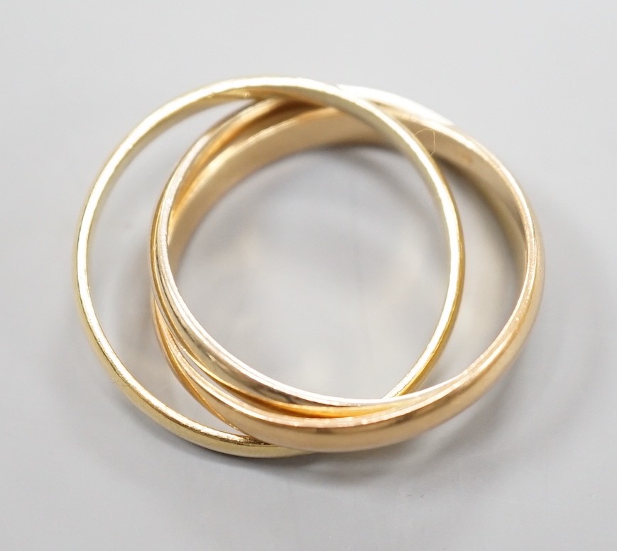 A modern Cartier three colour 750 yellow metal 'Russian' triple wedding ring, size U, 8.5 grams. - Image 5 of 5