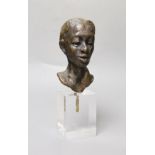 An abstract bronze bust of a girl, on perspex plinth, 24cm