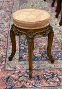 An early 20th century French carved walnut dressing stool