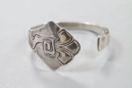An early 20th century Danish sterling openwork bangle, dated for 1911, with later engraved