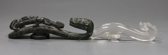 A Chinese rock crystal belt hook and a Chinese spinach green jade belt hook (2), largest 12cms