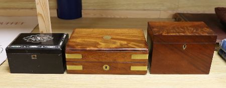 A Victorian mahogany brass bound sewing box, a mother of pearl and silver metal inlaid ebony tea